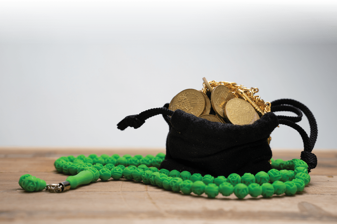 Islamic finance with coin in sack at the table  