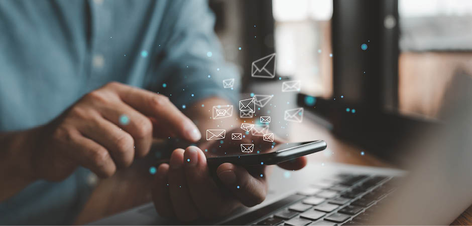 Man hand use smartphone with email icons being sent out. Communication business technology. Sending a message with your phone.