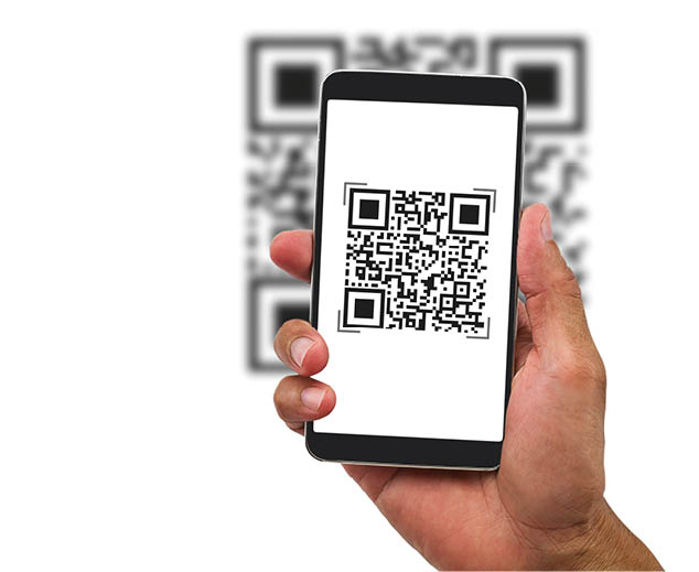 Man's hand holding smartphone scanning QR code on white background, business concept